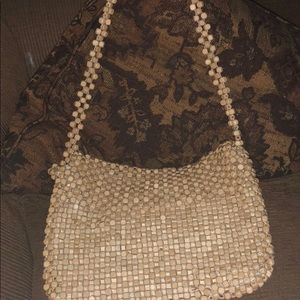 Beige beaded purse.